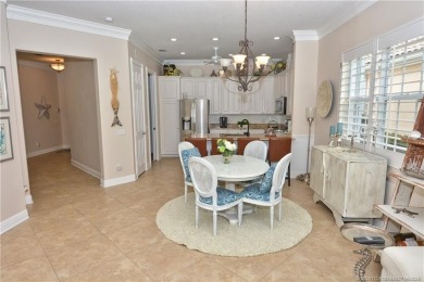 This Bermuda with it's inviting front porch and open-kitchen on The Florida Club in Florida - for sale on GolfHomes.com, golf home, golf lot