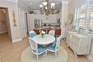 This Bermuda with it's inviting front porch and open-kitchen on The Florida Club in Florida - for sale on GolfHomes.com, golf home, golf lot