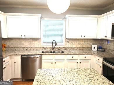 No HOA - Discover the perfect blend of contemporary elegance and on Charlie Yates Golf Course in Georgia - for sale on GolfHomes.com, golf home, golf lot