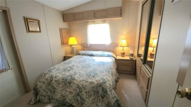 TWO BED, ONE BATH HOME IN ACTIVE 55+ COMMUNITY! This furnished on River Run Golf Links in Florida - for sale on GolfHomes.com, golf home, golf lot