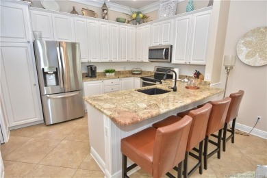 This Bermuda with it's inviting front porch and open-kitchen on The Florida Club in Florida - for sale on GolfHomes.com, golf home, golf lot