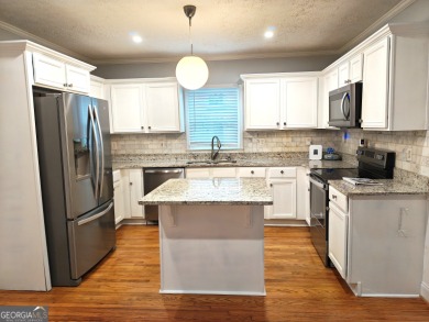 No HOA - Discover the perfect blend of contemporary elegance and on Charlie Yates Golf Course in Georgia - for sale on GolfHomes.com, golf home, golf lot