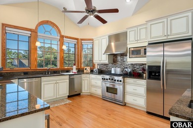 This 5-bedroom, 6.5-bath residence offers over 3,600 square feet on The Currituck Golf Club in North Carolina - for sale on GolfHomes.com, golf home, golf lot