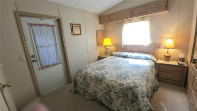 TWO BED, ONE BATH HOME IN ACTIVE 55+ COMMUNITY! This furnished on River Run Golf Links in Florida - for sale on GolfHomes.com, golf home, golf lot