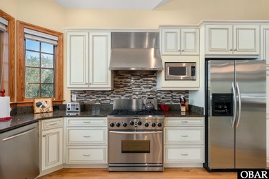 This 5-bedroom, 6.5-bath residence offers over 3,600 square feet on The Currituck Golf Club in North Carolina - for sale on GolfHomes.com, golf home, golf lot