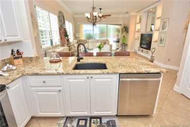 This Bermuda with it's inviting front porch and open-kitchen on The Florida Club in Florida - for sale on GolfHomes.com, golf home, golf lot