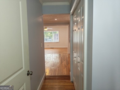 No HOA - Discover the perfect blend of contemporary elegance and on Charlie Yates Golf Course in Georgia - for sale on GolfHomes.com, golf home, golf lot