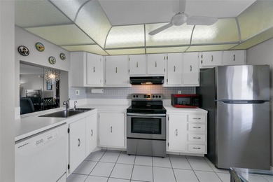 This bright 2-bedroom, 2-bath corner unit offers comfortable on Inverrary Country Club in Florida - for sale on GolfHomes.com, golf home, golf lot