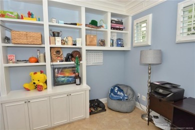 This Bermuda with it's inviting front porch and open-kitchen on The Florida Club in Florida - for sale on GolfHomes.com, golf home, golf lot