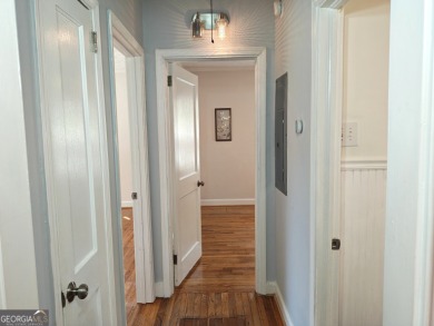 No HOA - Discover the perfect blend of contemporary elegance and on Charlie Yates Golf Course in Georgia - for sale on GolfHomes.com, golf home, golf lot