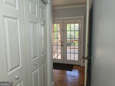 No HOA - Discover the perfect blend of contemporary elegance and on Charlie Yates Golf Course in Georgia - for sale on GolfHomes.com, golf home, golf lot