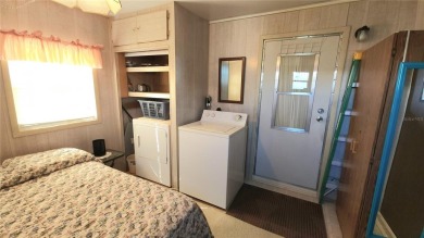 TWO BED, ONE BATH HOME IN ACTIVE 55+ COMMUNITY! This furnished on River Run Golf Links in Florida - for sale on GolfHomes.com, golf home, golf lot