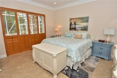 This Bermuda with it's inviting front porch and open-kitchen on The Florida Club in Florida - for sale on GolfHomes.com, golf home, golf lot