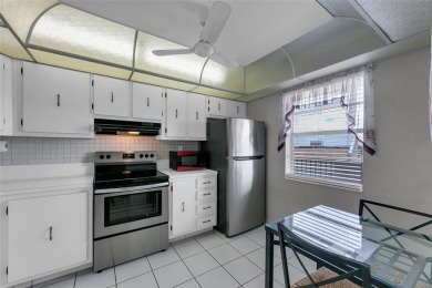 This bright 2-bedroom, 2-bath corner unit offers comfortable on Inverrary Country Club in Florida - for sale on GolfHomes.com, golf home, golf lot