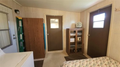 TWO BED, ONE BATH HOME IN ACTIVE 55+ COMMUNITY! This furnished on River Run Golf Links in Florida - for sale on GolfHomes.com, golf home, golf lot
