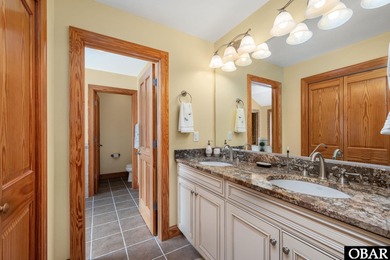 This 5-bedroom, 6.5-bath residence offers over 3,600 square feet on The Currituck Golf Club in North Carolina - for sale on GolfHomes.com, golf home, golf lot