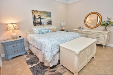 This Bermuda with it's inviting front porch and open-kitchen on The Florida Club in Florida - for sale on GolfHomes.com, golf home, golf lot