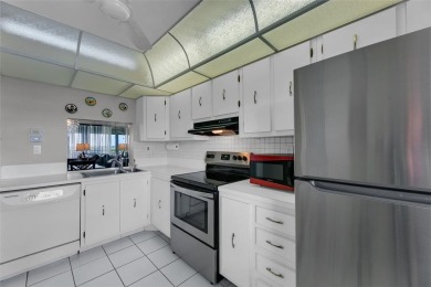 This bright 2-bedroom, 2-bath corner unit offers comfortable on Inverrary Country Club in Florida - for sale on GolfHomes.com, golf home, golf lot