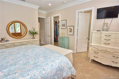 This Bermuda with it's inviting front porch and open-kitchen on The Florida Club in Florida - for sale on GolfHomes.com, golf home, golf lot