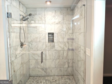 No HOA - Discover the perfect blend of contemporary elegance and on Charlie Yates Golf Course in Georgia - for sale on GolfHomes.com, golf home, golf lot