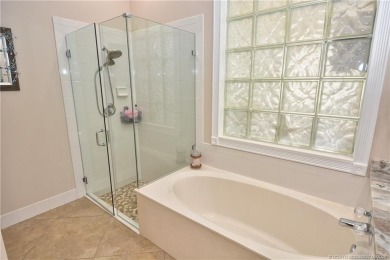 This Bermuda with it's inviting front porch and open-kitchen on The Florida Club in Florida - for sale on GolfHomes.com, golf home, golf lot