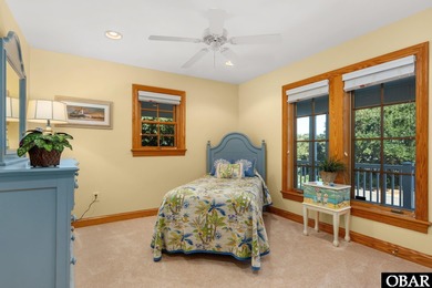 This 5-bedroom, 6.5-bath residence offers over 3,600 square feet on The Currituck Golf Club in North Carolina - for sale on GolfHomes.com, golf home, golf lot