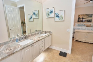 This Bermuda with it's inviting front porch and open-kitchen on The Florida Club in Florida - for sale on GolfHomes.com, golf home, golf lot