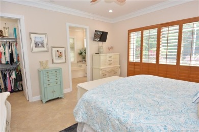 This Bermuda with it's inviting front porch and open-kitchen on The Florida Club in Florida - for sale on GolfHomes.com, golf home, golf lot