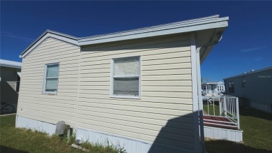 TWO BED, ONE BATH HOME IN ACTIVE 55+ COMMUNITY! This furnished on River Run Golf Links in Florida - for sale on GolfHomes.com, golf home, golf lot