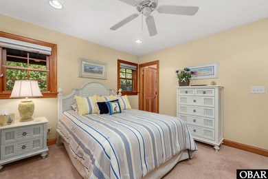 This 5-bedroom, 6.5-bath residence offers over 3,600 square feet on The Currituck Golf Club in North Carolina - for sale on GolfHomes.com, golf home, golf lot
