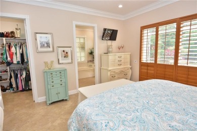This Bermuda with it's inviting front porch and open-kitchen on The Florida Club in Florida - for sale on GolfHomes.com, golf home, golf lot