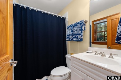 This 5-bedroom, 6.5-bath residence offers over 3,600 square feet on The Currituck Golf Club in North Carolina - for sale on GolfHomes.com, golf home, golf lot
