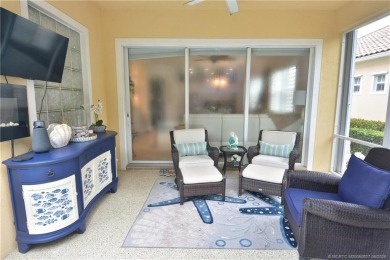 This Bermuda with it's inviting front porch and open-kitchen on The Florida Club in Florida - for sale on GolfHomes.com, golf home, golf lot