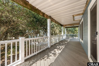 This 5-bedroom, 6.5-bath residence offers over 3,600 square feet on The Currituck Golf Club in North Carolina - for sale on GolfHomes.com, golf home, golf lot