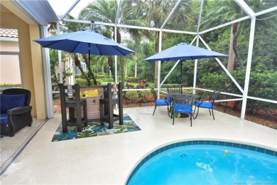 This Bermuda with it's inviting front porch and open-kitchen on The Florida Club in Florida - for sale on GolfHomes.com, golf home, golf lot