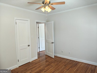 No HOA - Discover the perfect blend of contemporary elegance and on Charlie Yates Golf Course in Georgia - for sale on GolfHomes.com, golf home, golf lot