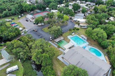 TWO BED, ONE BATH HOME IN ACTIVE 55+ COMMUNITY! This furnished on River Run Golf Links in Florida - for sale on GolfHomes.com, golf home, golf lot