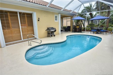 This Bermuda with it's inviting front porch and open-kitchen on The Florida Club in Florida - for sale on GolfHomes.com, golf home, golf lot