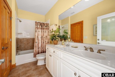 This 5-bedroom, 6.5-bath residence offers over 3,600 square feet on The Currituck Golf Club in North Carolina - for sale on GolfHomes.com, golf home, golf lot