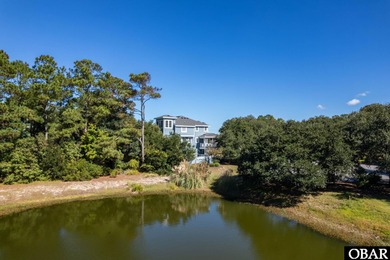 This 5-bedroom, 6.5-bath residence offers over 3,600 square feet on The Currituck Golf Club in North Carolina - for sale on GolfHomes.com, golf home, golf lot