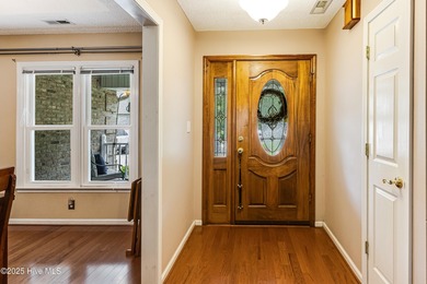 Tucked at the end of a cul-de-sac, this stunning brick home on Lockwood Folly Country Club in North Carolina - for sale on GolfHomes.com, golf home, golf lot