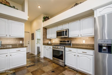 Welcome to this stunning Estrella custom home, situated on 1/2 on Estrella Mountain Ranch Golf Course in Arizona - for sale on GolfHomes.com, golf home, golf lot