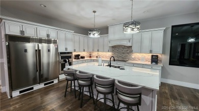 2023 construction, stunning home and is TURNKEY! Stucco & stone on The Club At Porto Cima in Missouri - for sale on GolfHomes.com, golf home, golf lot
