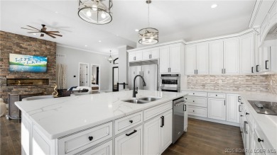 2023 construction, stunning home and is TURNKEY! Stucco & stone on The Club At Porto Cima in Missouri - for sale on GolfHomes.com, golf home, golf lot