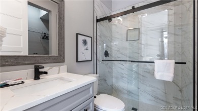 2023 construction, stunning home and is TURNKEY! Stucco & stone on The Club At Porto Cima in Missouri - for sale on GolfHomes.com, golf home, golf lot
