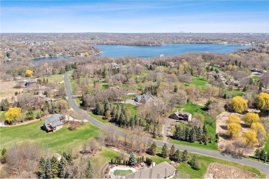 Tucked within the prestigious and serene Lake Riley Woods on Halla Green Executive Golf Course in Minnesota - for sale on GolfHomes.com, golf home, golf lot
