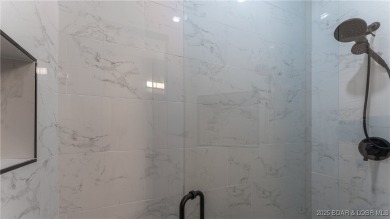 2023 construction, stunning home and is TURNKEY! Stucco & stone on The Club At Porto Cima in Missouri - for sale on GolfHomes.com, golf home, golf lot