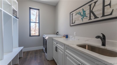 2023 construction, stunning home and is TURNKEY! Stucco & stone on The Club At Porto Cima in Missouri - for sale on GolfHomes.com, golf home, golf lot