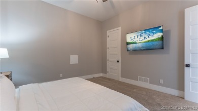 2023 construction, stunning home and is TURNKEY! Stucco & stone on The Club At Porto Cima in Missouri - for sale on GolfHomes.com, golf home, golf lot