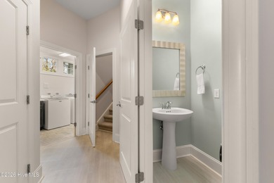 Experience the pinnacle of coastal elegance in this like-new on Members Club At St. James Plantation in North Carolina - for sale on GolfHomes.com, golf home, golf lot